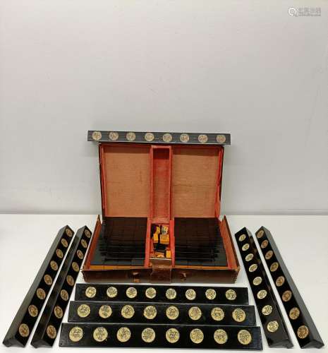 A Mah-Jong set, in a leather case, 35 cm wide, and eight mar...