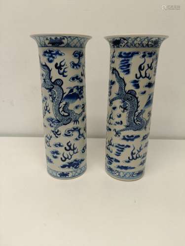 A pair of Chinese blue and white vases, decorated dragons ch...