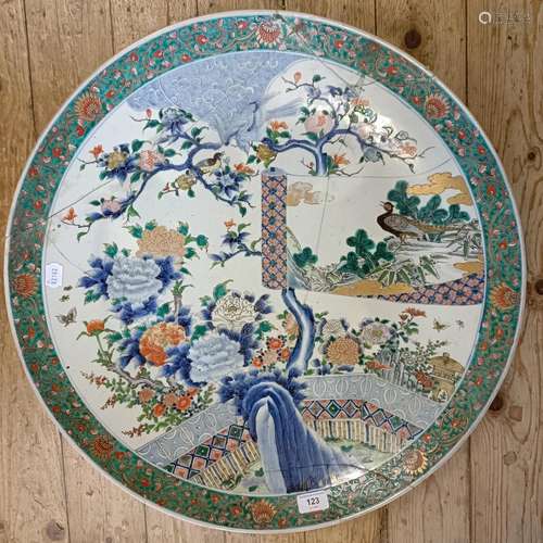 A large Chinese famille verte charger, decorated a landscape...