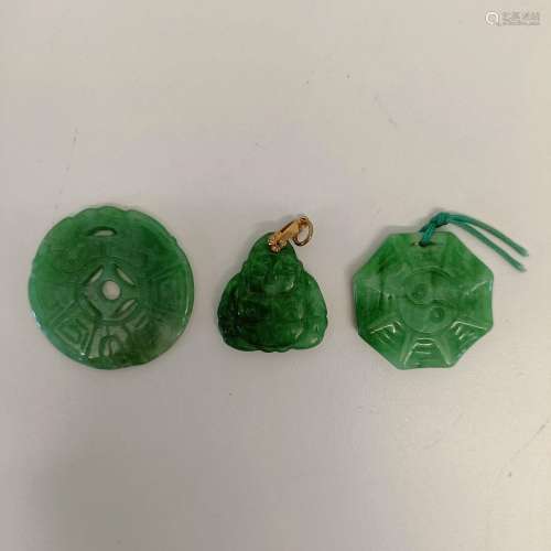 A Chinese carved jadeite buddha pendant, 2.5 cm wide, and tw...