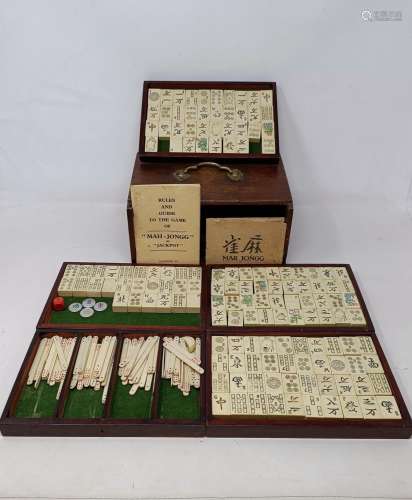 A Mah Jong set in a hardwood case, 23 cm wide