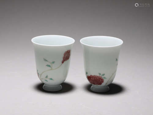 A pair of underglaze red flower cups in Kangxi of Qing Dynas...