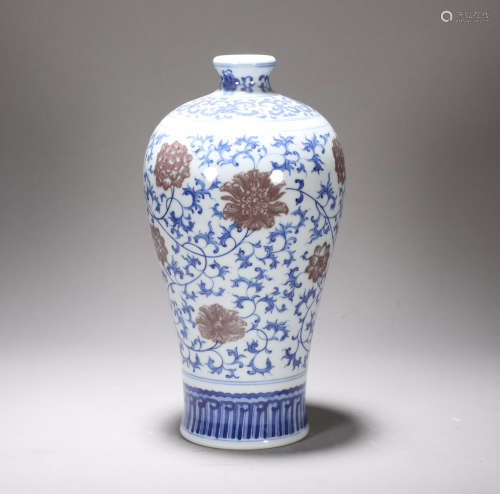 The red-wrapped plum bottle in the blue and white glaze of Y...