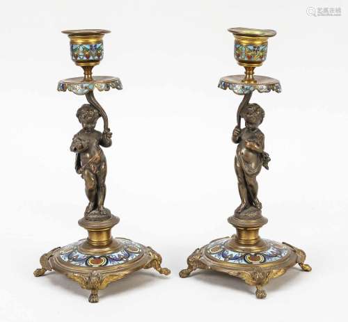 Pair of figural candelabra with clo