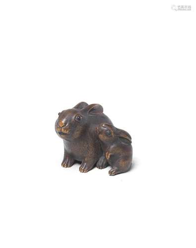 A WOOD NETSUKE OF TWO RABBITS By Masanao, Yamada, Ise Provin...