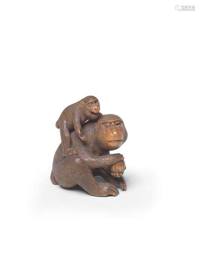 A WOOD NETSUKE OF TWO MONKEYS By Sadakazu, Edo period (1615-...