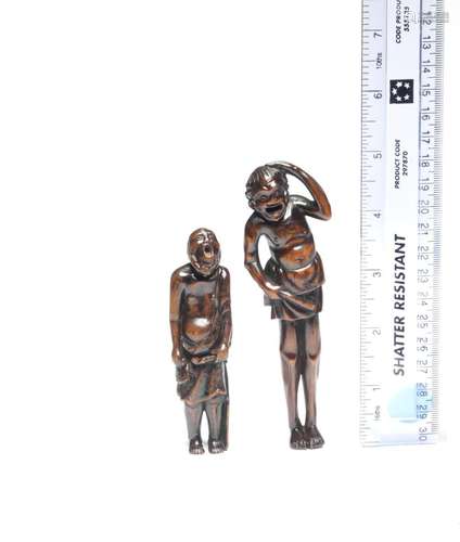 TWO TALL WOOD NETSUKE Edo period (1615-1868), late 18th to m...