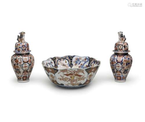 A LARGE PORCELAIN PUNCH BOWL AND TWO COVERED BALUSTER VASES ...