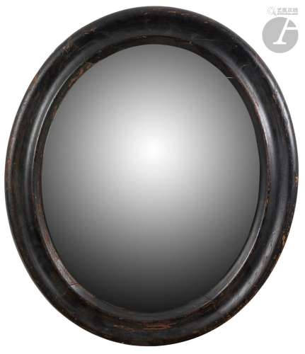 Miroir ovale en bois noirci