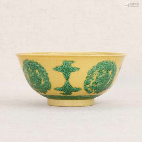 A Chinese yellow-ground green-enamelled bowl,