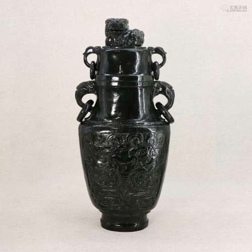 A Chinese spinach jade vase and cover,