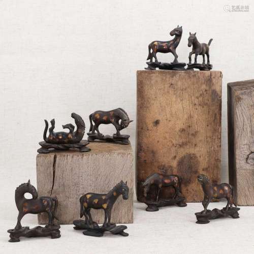 A collection of eight Chinese bronze horses,