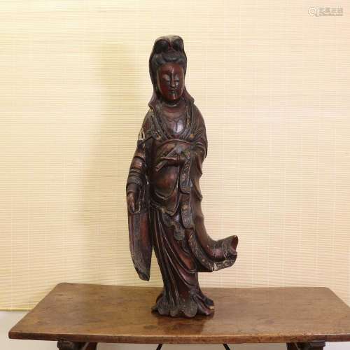 A Chinese lacquered wood guanyin,