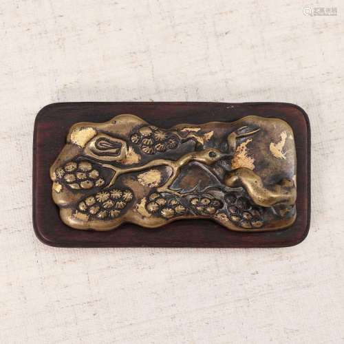 A Chinese bronze ink rest,