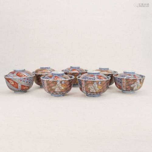 A collection of seven Chinese blue and white bowls and cover...
