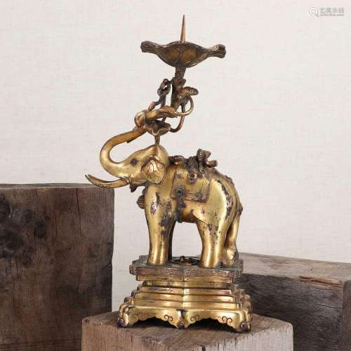 A Chinese gilt-bronze candlestick,