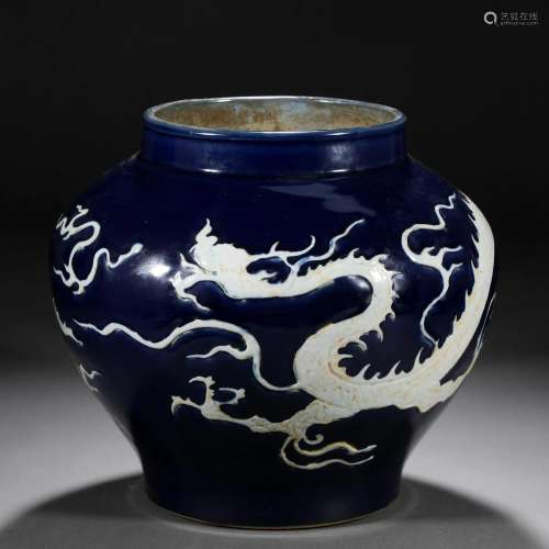 A Chinese Blue and White Reserve Decorated Dragon Jar