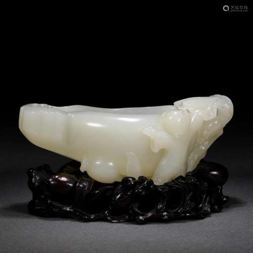 A Chinese Carved White Jade Washer