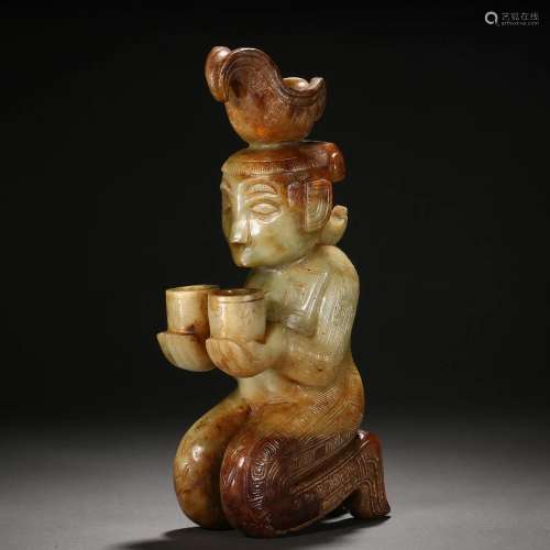 A Chinese Carved Jade Kneeling Figure