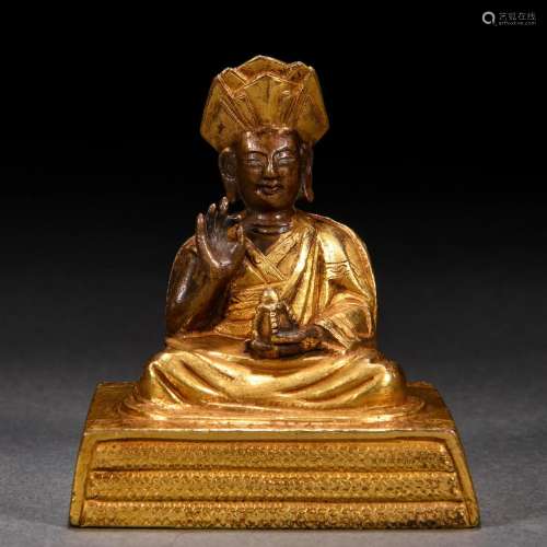 A Tibetan Bronze-gilt Seated Lama