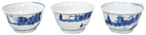 THREE BLUE AND WHITE LOTUS-PETAL-MOULDED WINE CUPS QING DYNA...
