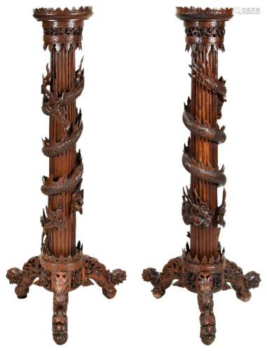 IMPRESSIVE PAIR OF DRAGON-CARVED HUANGHUALI STANDS QING DYNA...