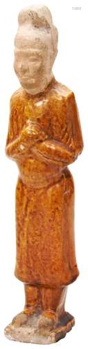 AMBER-GLAZED POTTERY FIGURE OF A MALE ATTENDANT TANG DYNASTY...