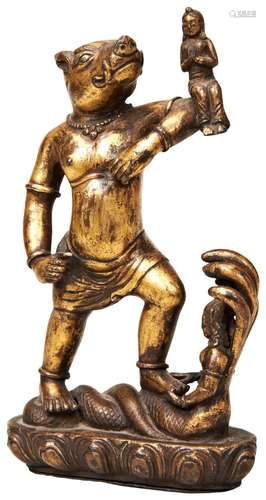 A TIBETAN GILT BRONZE ZOOMORPHIC FIGURE OF A DEITY WITH BUDD...