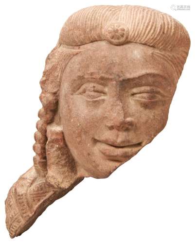 A FINELY CARVED SANDSTONE HEAD FRAGMENT OF A DEITY, PROBABLY...