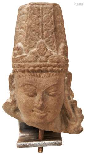 A CARVED SANDSTONE HEAD OF VISHNU, NORTHERN INDIAN, the clea...