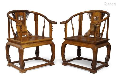 A pair of Chinese rosewood horseshoe backed armchairs, quany...