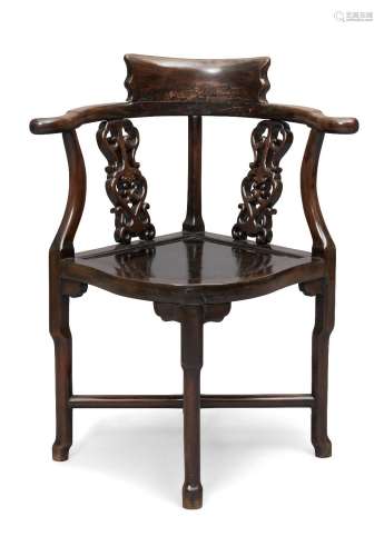 A Chinese hardwood corner chair, early 20th century with pie...