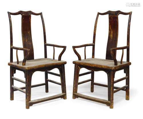A pair of Chinese lacquered elm armchairs, late 19th century...
