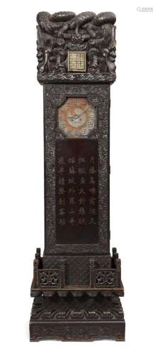 A Chinese lacquered wood 'dragon' longcase clock, early 20th...
