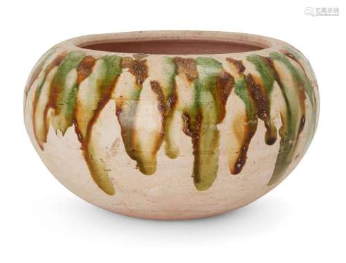 A Chinese sancai-glazed pottery jar, Tang dynasty, splashed ...