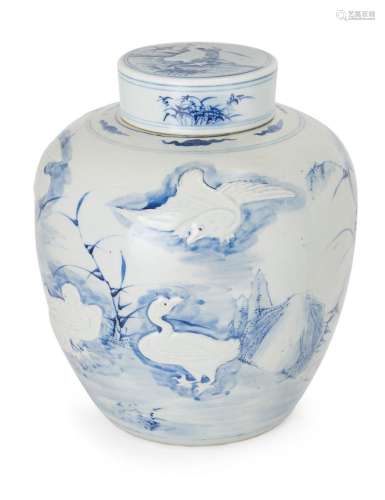 A large Chinese moulded blue and white jar and cover, 19th c...