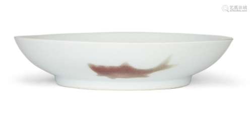 A Chinese copper-red porcelain ‘three fishes’ saucer dish, Y...