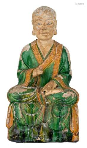 A large Chinese fahua-glazed stoneware figure of a monk, Min...