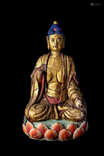 A Chinese gilt and painted stucco figure of Buddha, Ming dyn...