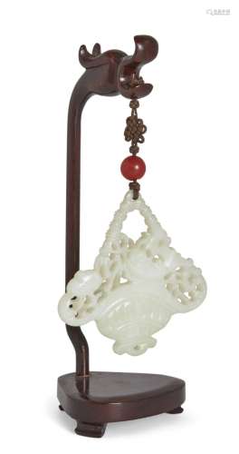 A Chinese jade 'flower vase' hanging pendant, 19th century, ...