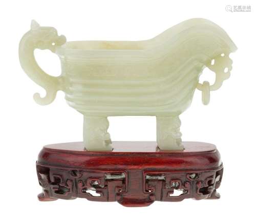 A Chinese celadon jade archaistic pouring vessel, yi, Republ...