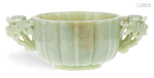A large Chinese twin-handled celadon jade bowl, late Qing Dy...