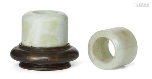 Two Chinese jadeite archer's rings, 19th century, one with a...