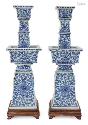 A pair of Chinese blue and white square pricket candlesticks...