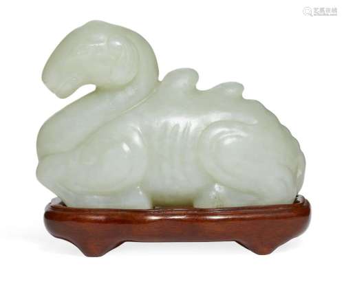 A Chinese Song-style celadon jade carving of a recumbent cam...