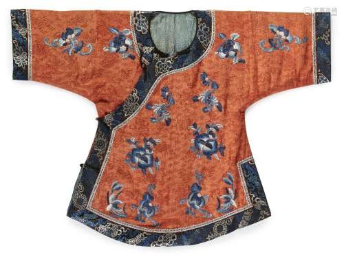 A Chinese silk embroidered coral ground child’s jacket, 19th...