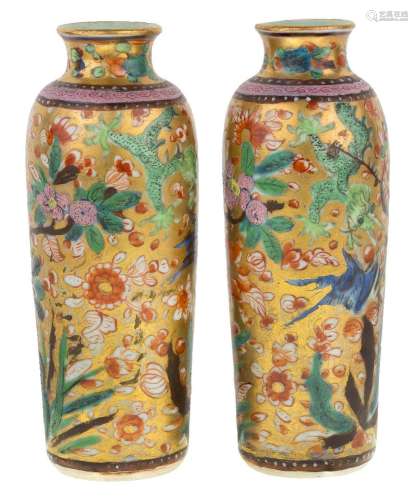 A pair of blue and white 'clobbered' sleeve vases, 17th cent...