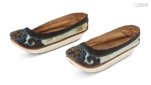 A pair of Chinese silk embroidered Manchu ladies' shoes, lat...