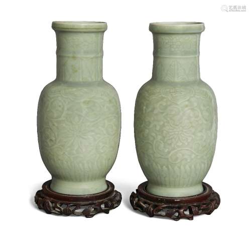 A pair of Chinese celadon-glazed carved 'lotus' vases, late ...
