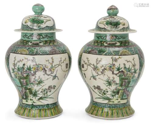 A pair of Chinese famille verte jars with covers, 19th centu...